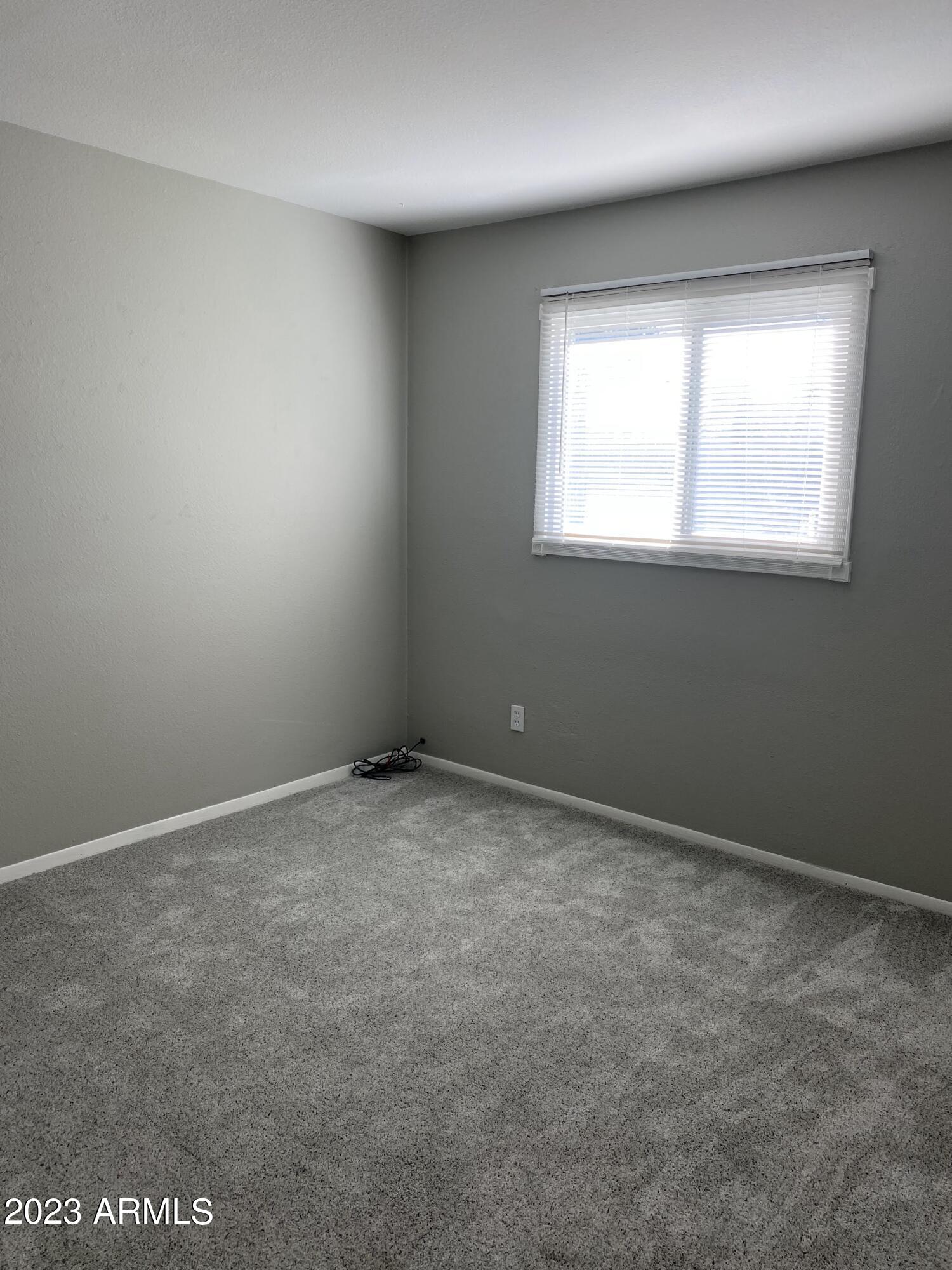 6617 South Granada Drive Tempe, AZ 85283 - Photo 10 of 20 an empty room with a window