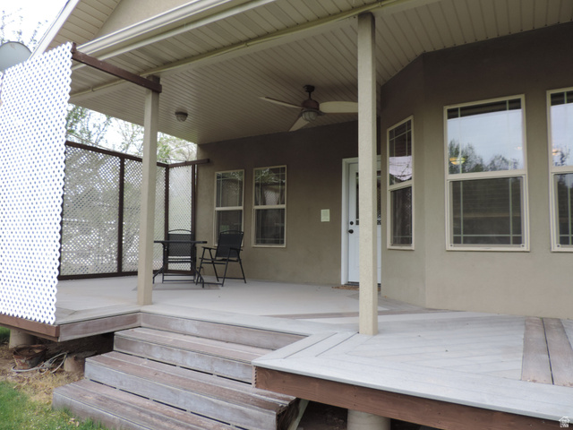 140 North 200 E Street Glenwood, UT 84730 - Photo 46 of 54 Wooden deck with a ceiling fan