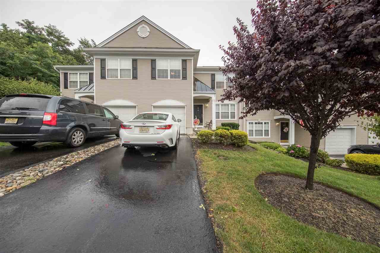 35 Rock Road, Unit 35 Wayne, NJ 07470 - Photo 1 of 1 a view of a big house with a cars park in front of a house