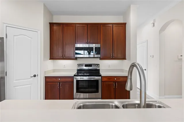 a bathroom with a bathtub a sink a toilet and a mirror