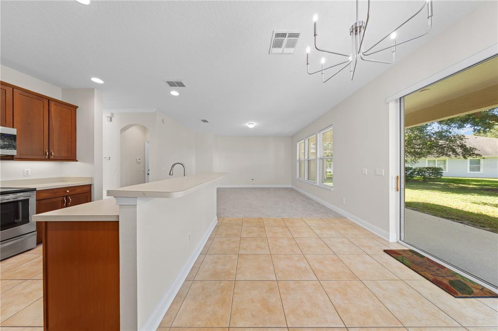7224 Halton Court Windermere, FL 34786 - Photo 13 of 50 a view of a kitchen with a sink and dishwasher with a fireplace