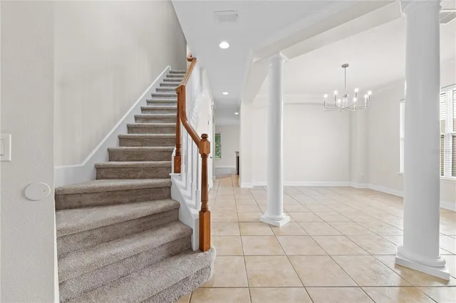 a large kitchen with stainless steel appliances granite countertop a sink counter space cabinets and a large window