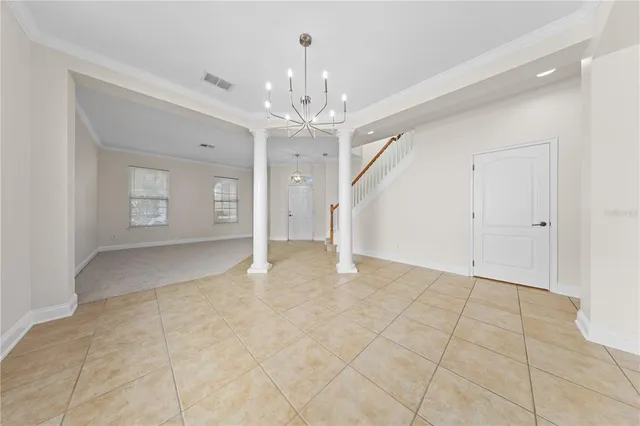 a view of a kitchen with a sink and dishwasher with a fireplace