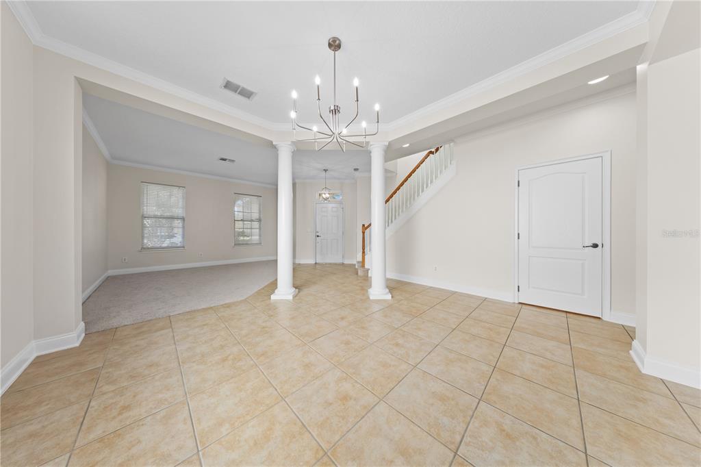 7224 Halton Court Windermere, FL 34786 - Photo 7 of 50 a view of an empty room with a chandelier