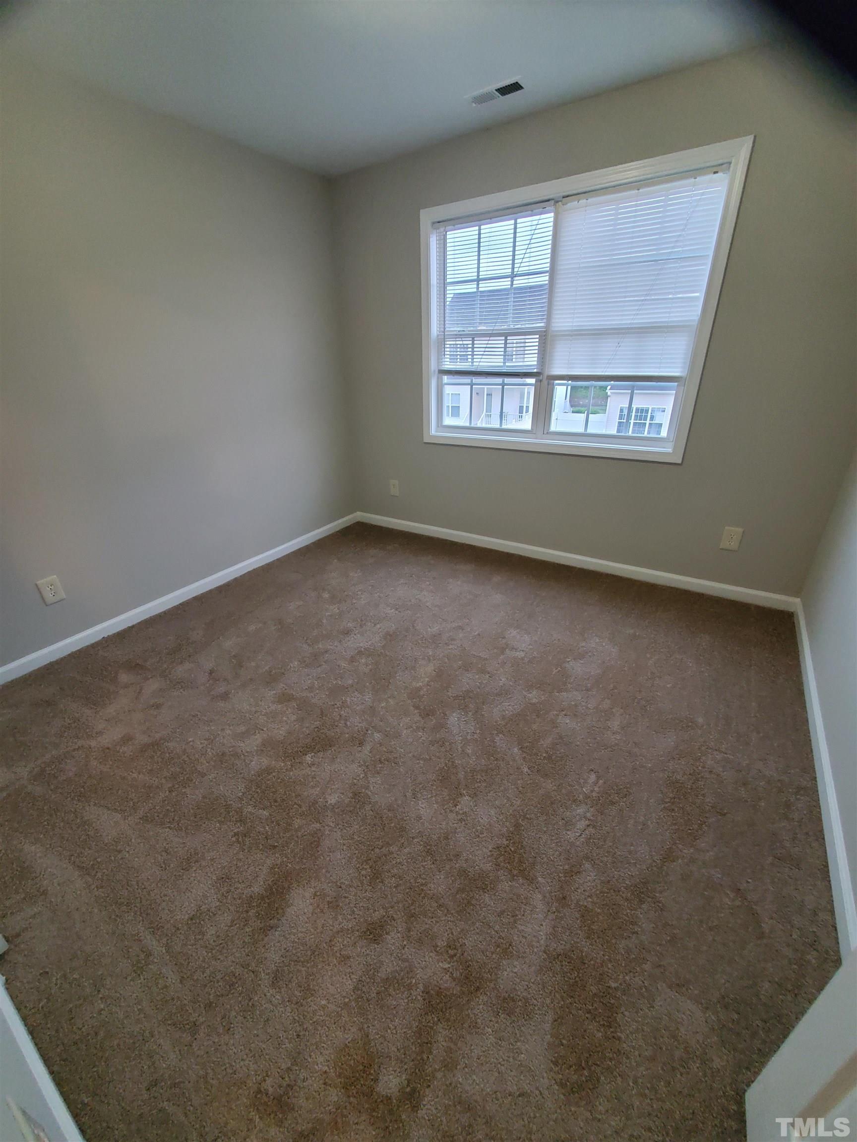 4216 Beacon Crest Way Raleigh, NC 27604 - Photo 16 of 22 an empty room with a window
