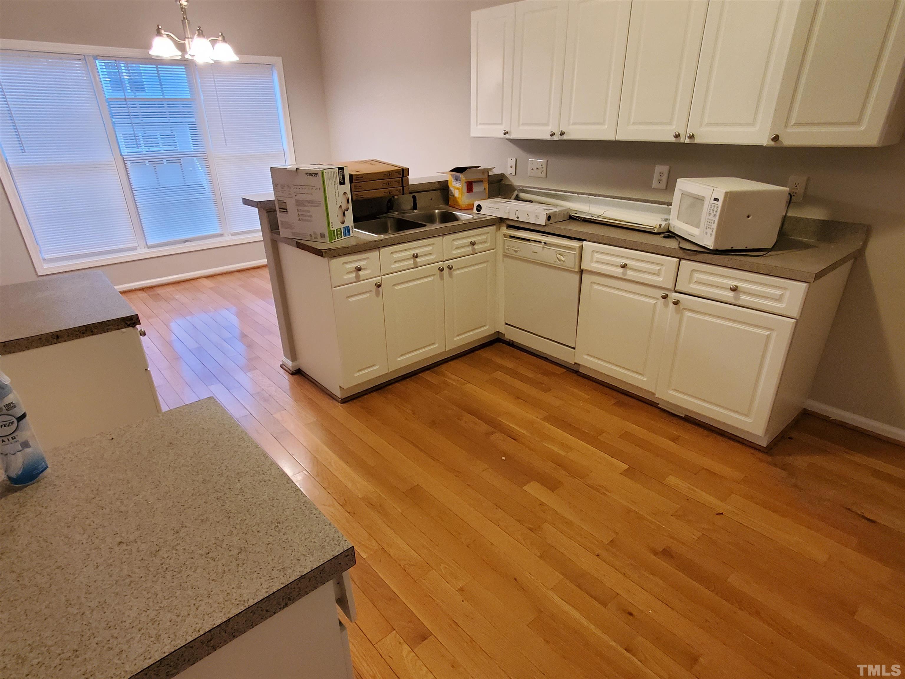 4216 Beacon Crest Way Raleigh, NC 27604 - Photo 8 of 22 a kitchen with cabinets and appliances