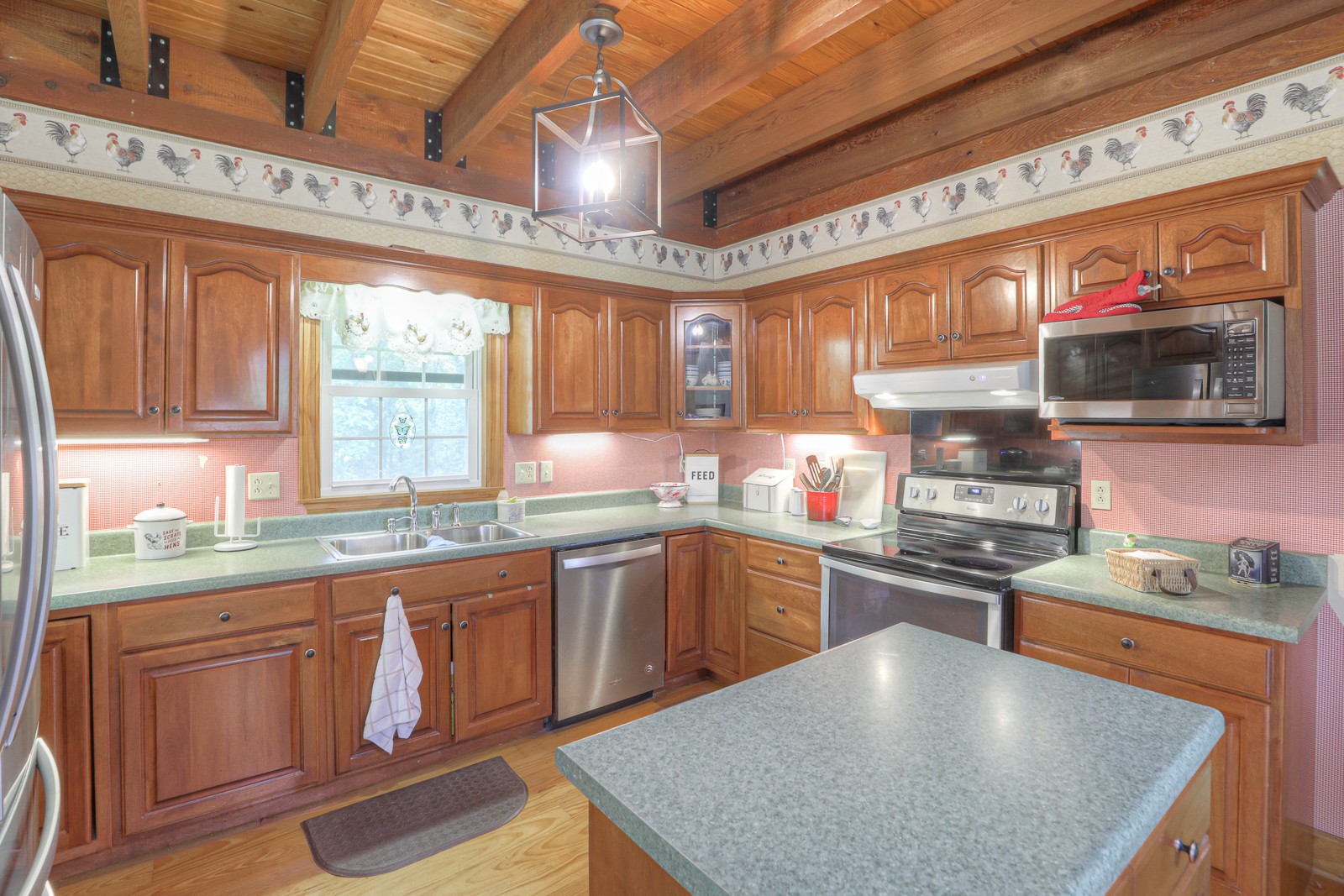 1421 Pea Ridge Road Manchester, TN 37355 - Photo 11 of 62 a kitchen with stainless steel appliances granite countertop a sink a stove and cabinets