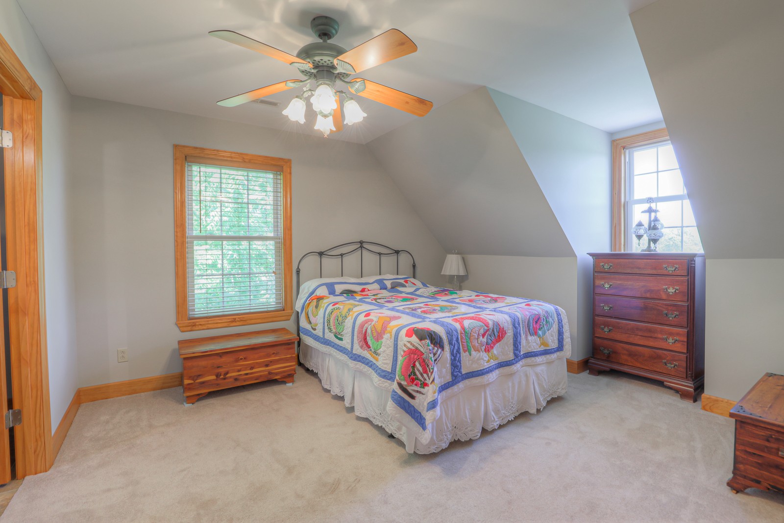 1421 Pea Ridge Road Manchester, TN 37355 - Photo 25 of 62 a spacious bedroom with a bed and a chandelier