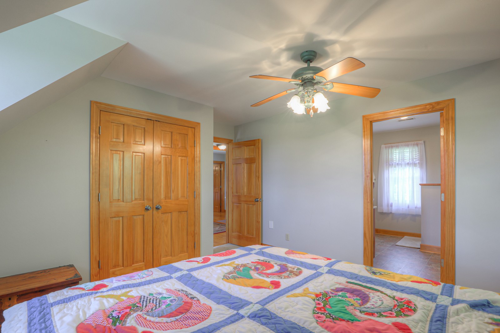 1421 Pea Ridge Road Manchester, TN 37355 - Photo 26 of 62 a bedroom with a bed and a chandelier