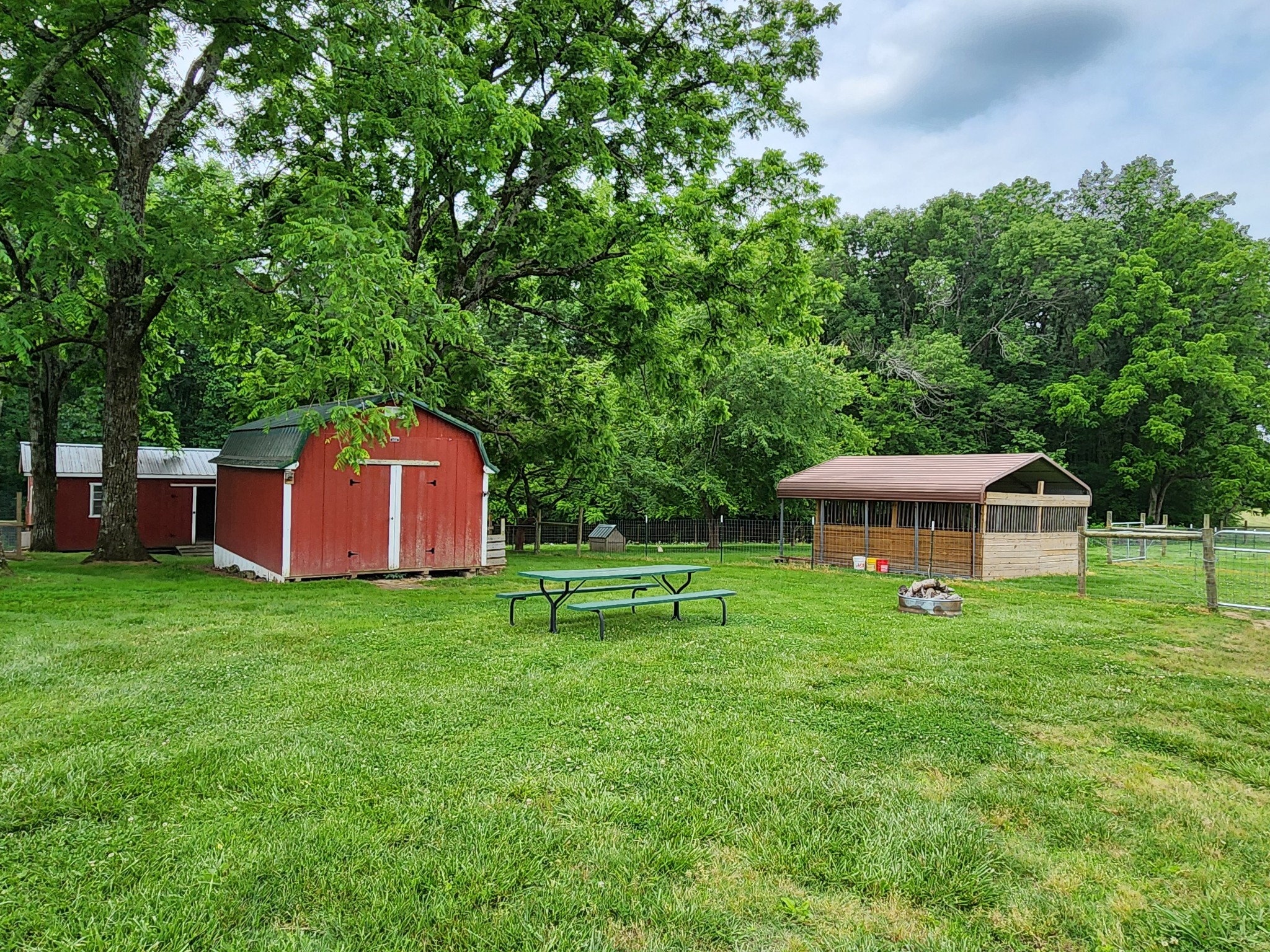 1421 Pea Ridge Road Manchester, TN 37355 - Photo 38 of 62 a front view of a house with a yard and trees