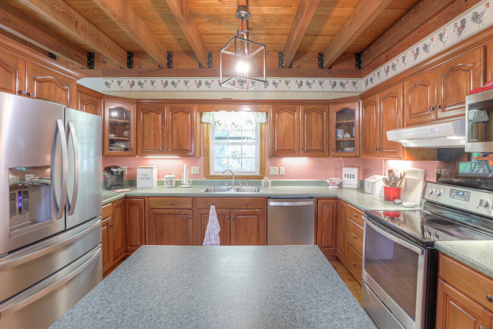 1421 Pea Ridge Road Manchester, TN 37355 - Photo 10 of 62 a kitchen with stainless steel appliances granite countertop a sink a stove and refrigerator