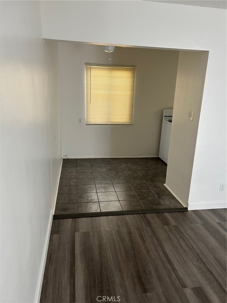 640 West Imperial Avenue, Unit 3 El Segundo, CA 90245 - Photo 3 of 9 an empty room with wooden floor and windows