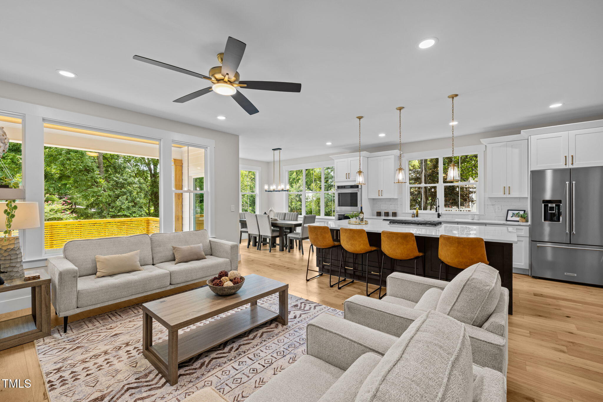 121 West Braxton Foushee Street Carrboro, NC 27510 - Photo 48 of 50 a living room with furniture ceiling fan and a large window