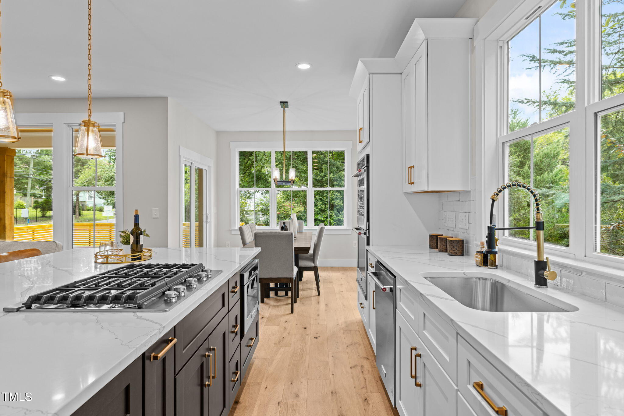 121 West Braxton Foushee Street Carrboro, NC 27510 - Photo 9 of 50 a kitchen with a sink stove top oven and cabinets