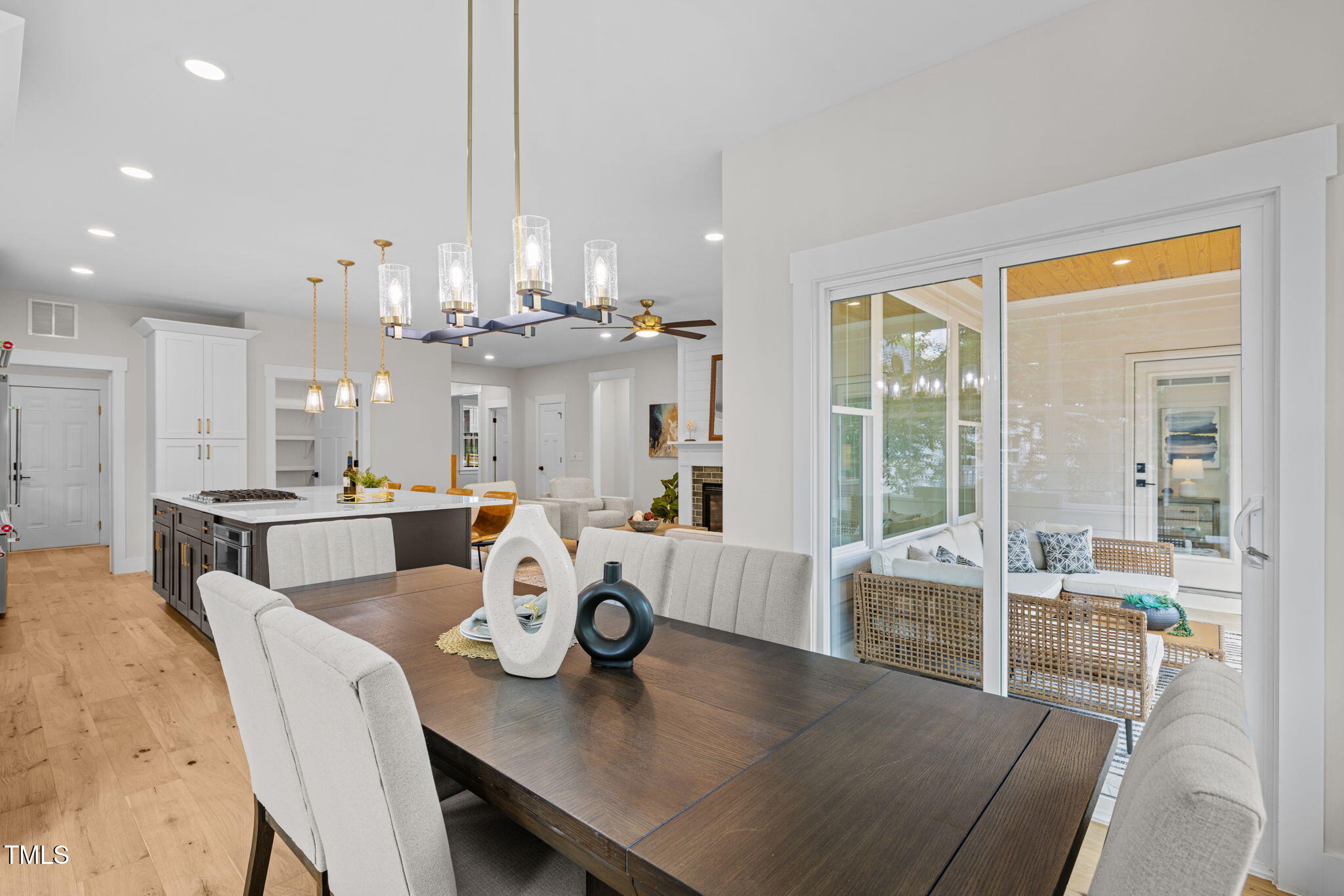 121 West Braxton Foushee Street Carrboro, NC 27510 - Photo 11 of 50 a view of a dining room and livingroom view with furniture wooden floor kitchen chandelier