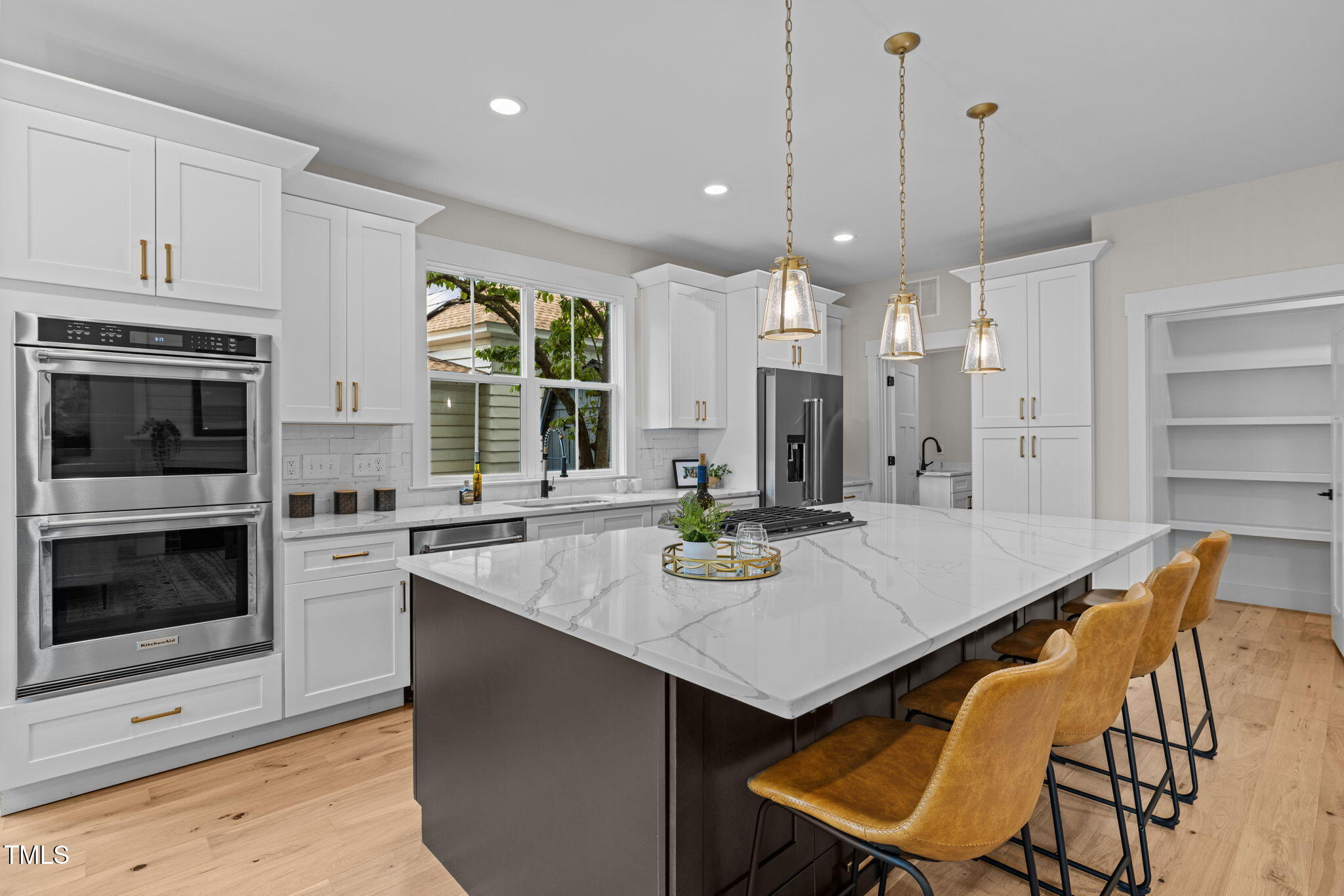 121 West Braxton Foushee Street Carrboro, NC 27510 - Photo 12 of 50 a kitchen with a table chairs stove and microwave