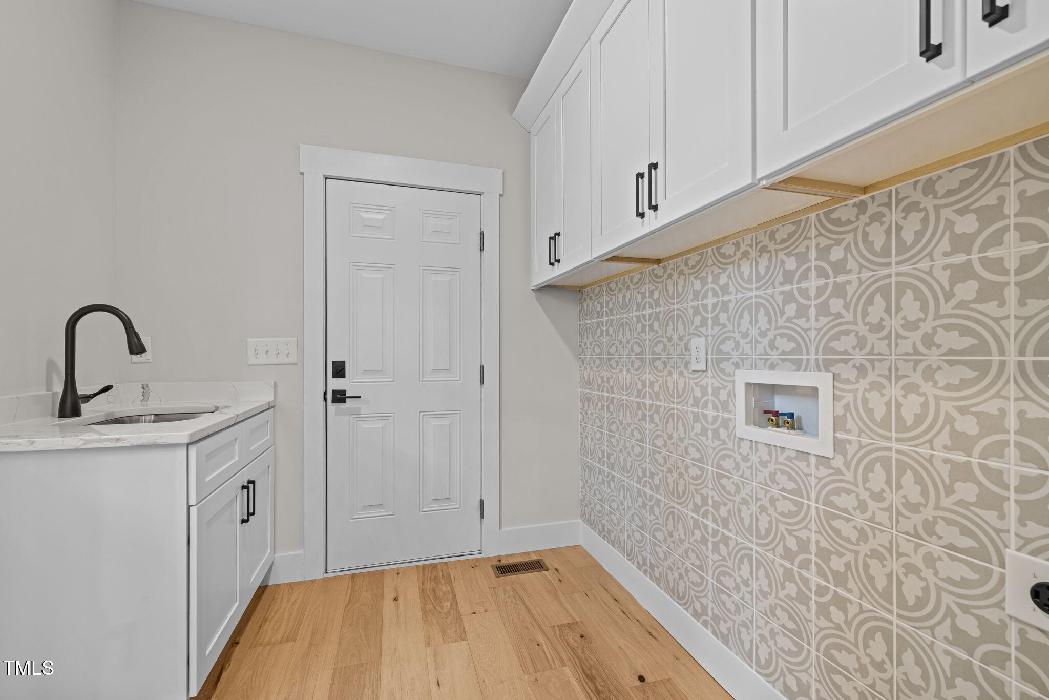 121 West Braxton Foushee Street Carrboro, NC 27510 - Photo 14 of 50 a bathroom with a sink and a mirror