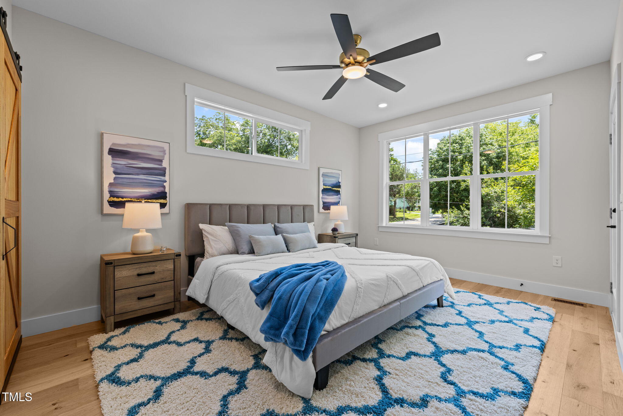 121 West Braxton Foushee Street Carrboro, NC 27510 - Photo 17 of 50 a spacious bedroom with a bed a dresser and a window