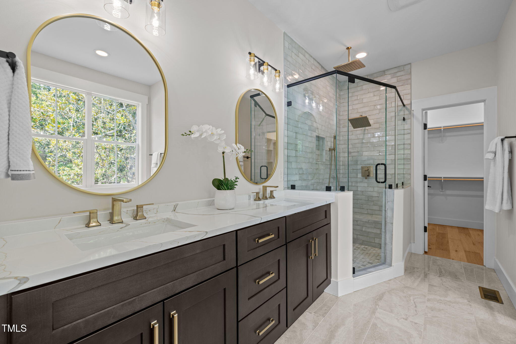 121 West Braxton Foushee Street Carrboro, NC 27510 - Photo 20 of 50 a bathroom with a double vanity sink mirror and shower