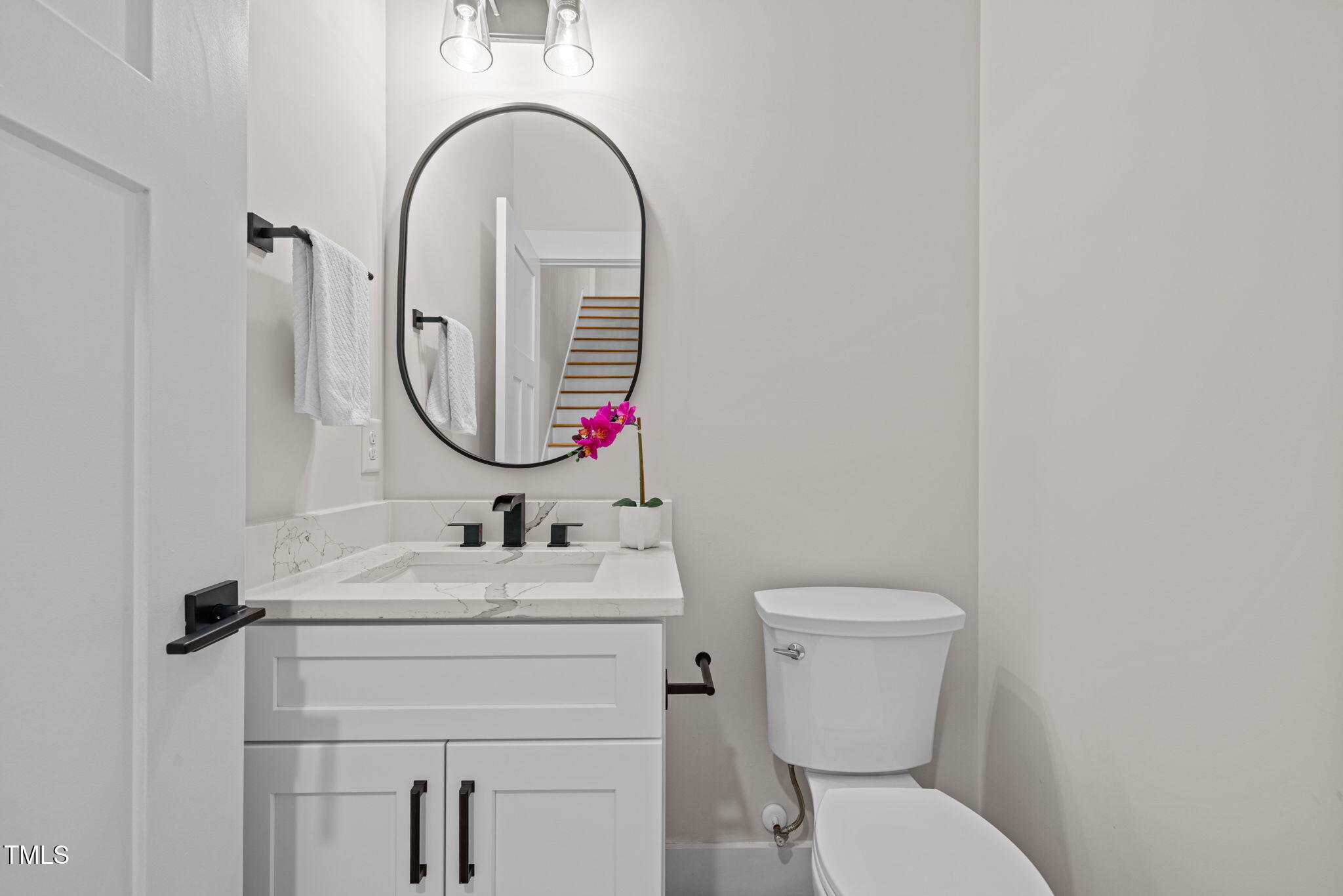121 West Braxton Foushee Street Carrboro, NC 27510 - Photo 24 of 50 a bathroom with a toilet sink and mirror