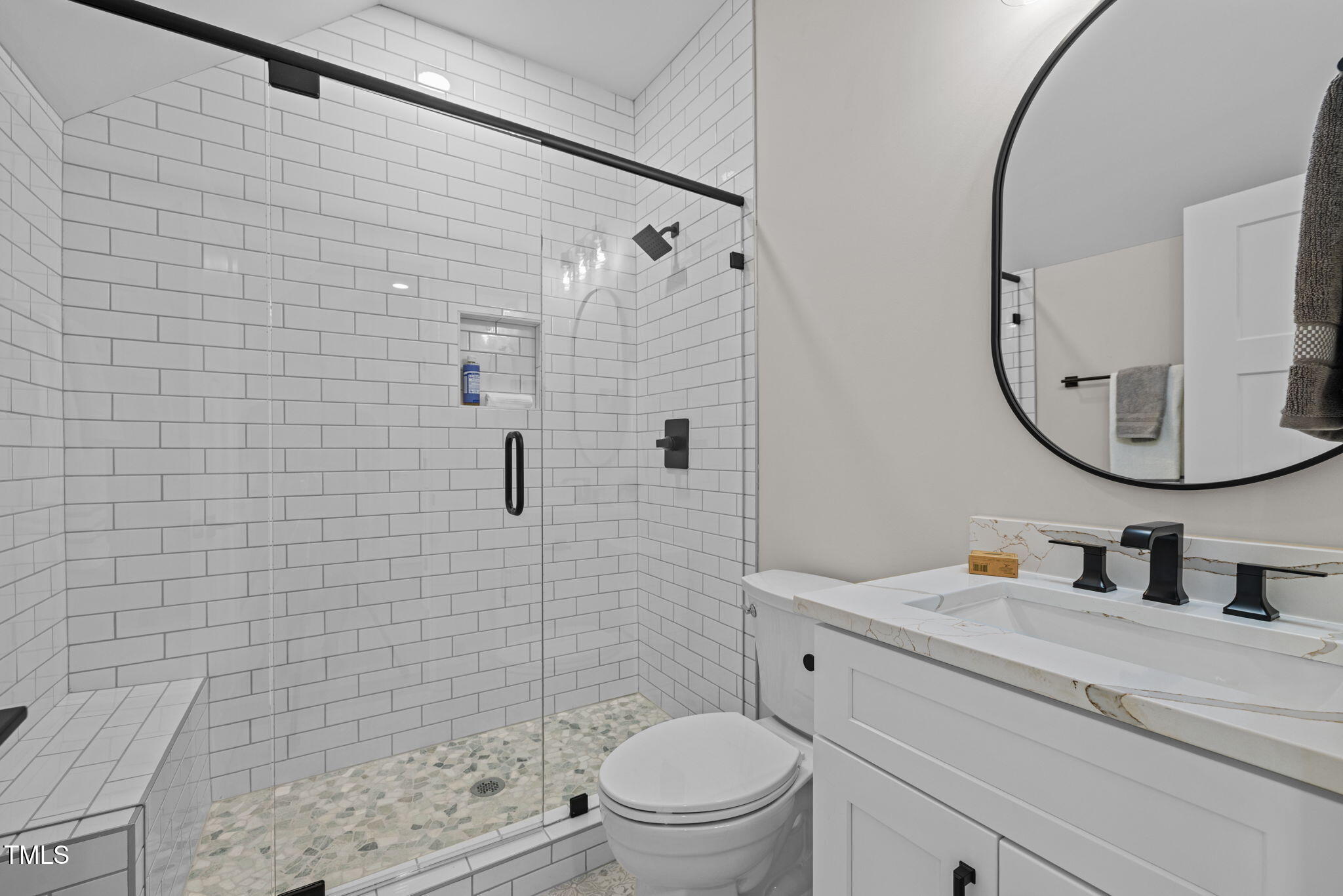 121 West Braxton Foushee Street Carrboro, NC 27510 - Photo 29 of 50 a bathroom with a sink a toilet and shower