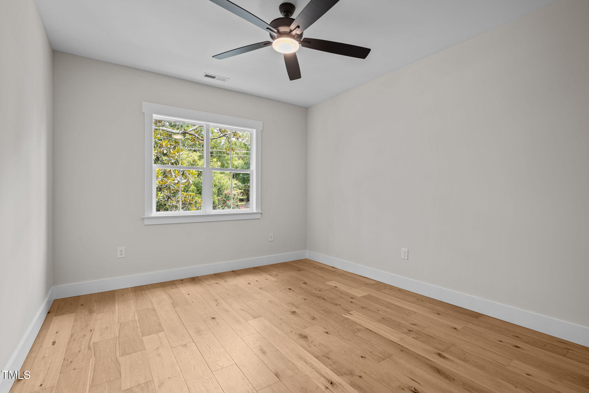 121 West Braxton Foushee Street Carrboro, NC 27510 - Photo 30 of 50 wooden floor in an empty room with a window