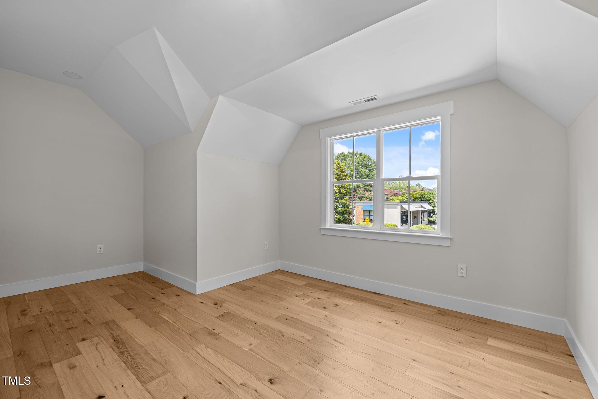 121 West Braxton Foushee Street Carrboro, NC 27510 - Photo 33 of 50 an empty room with wooden floor and windows
