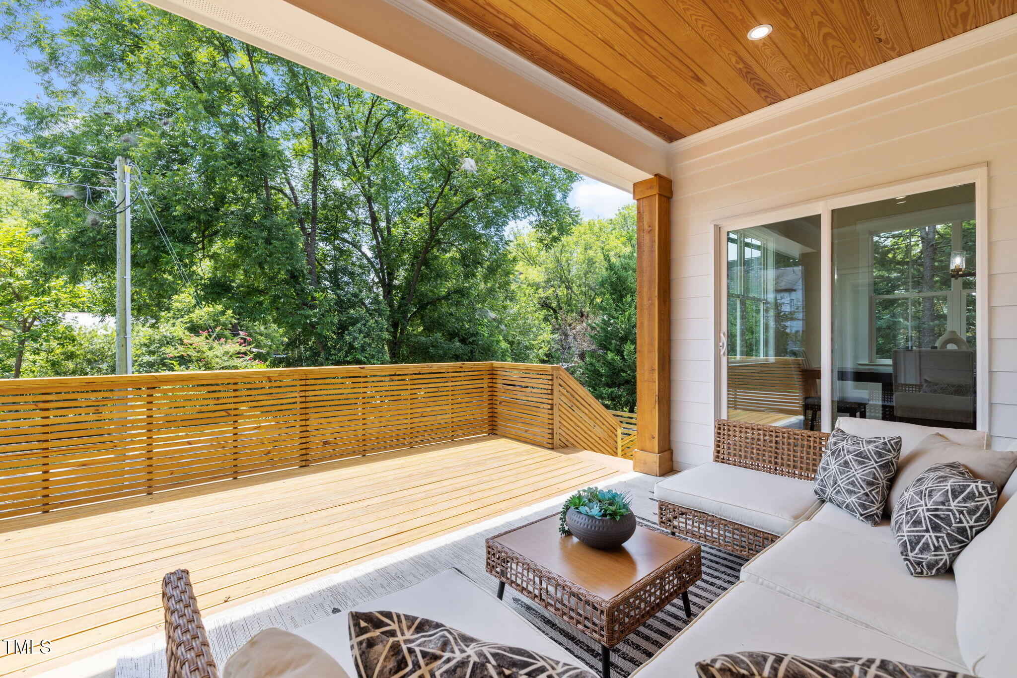121 West Braxton Foushee Street Carrboro, NC 27510 - Photo 36 of 50 a view of a patio with couches table and chairs and wooden floor