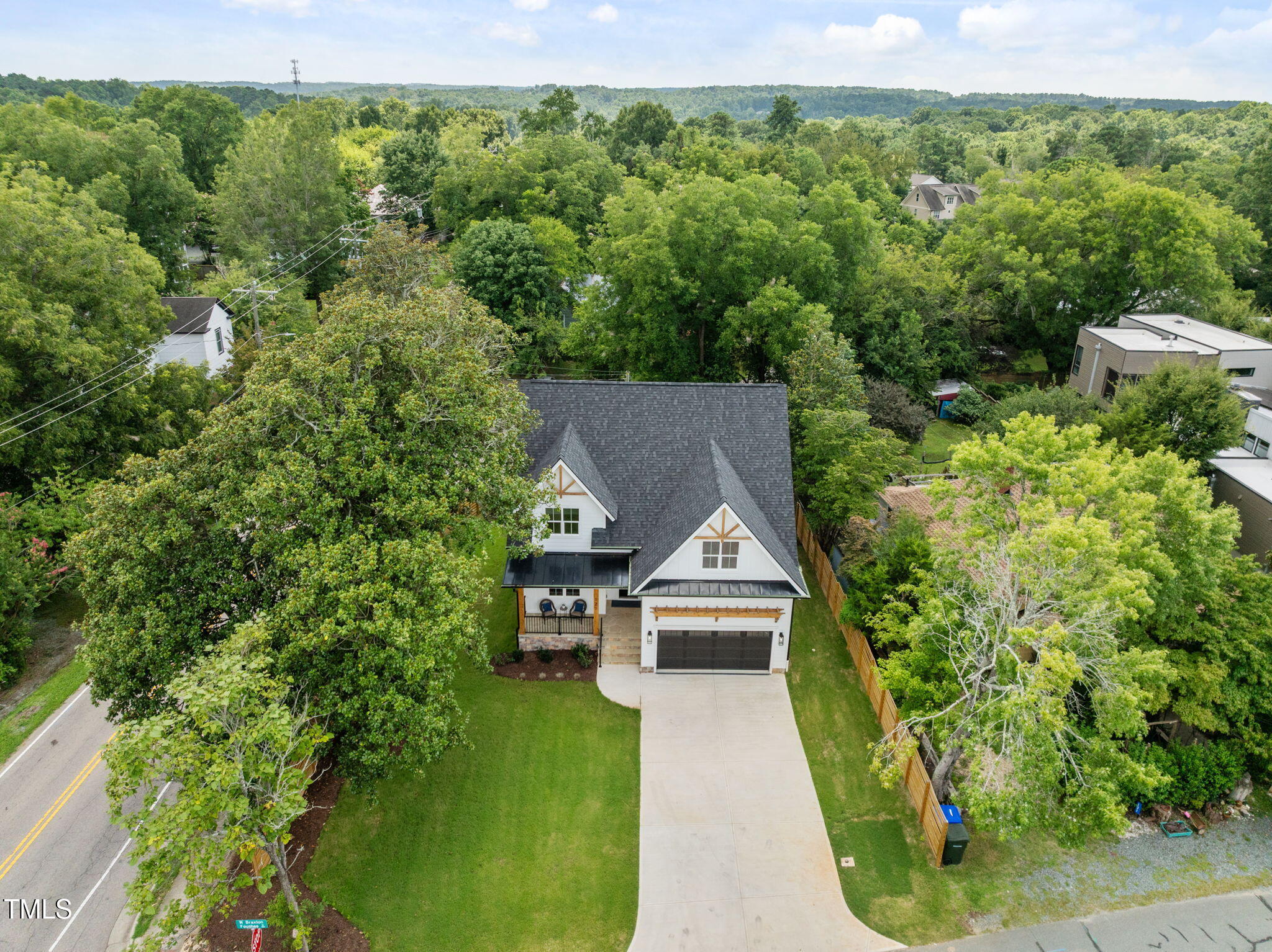 121 West Braxton Foushee Street Carrboro, NC 27510 - Photo 42 of 50 a view of house with garden space and trees