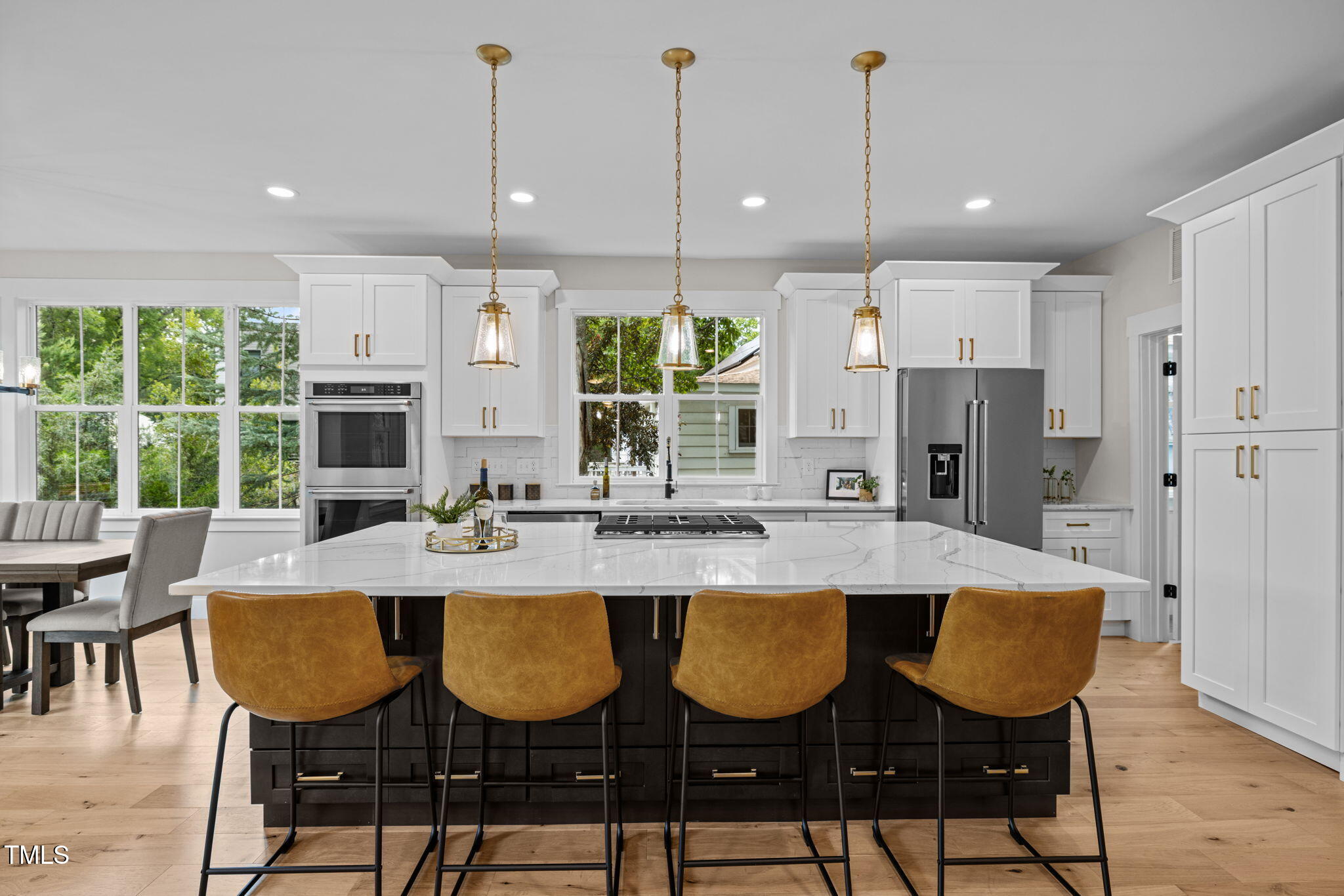 121 West Braxton Foushee Street Carrboro, NC 27510 - Photo 4 of 50 a dining table painted chairs and chandelier