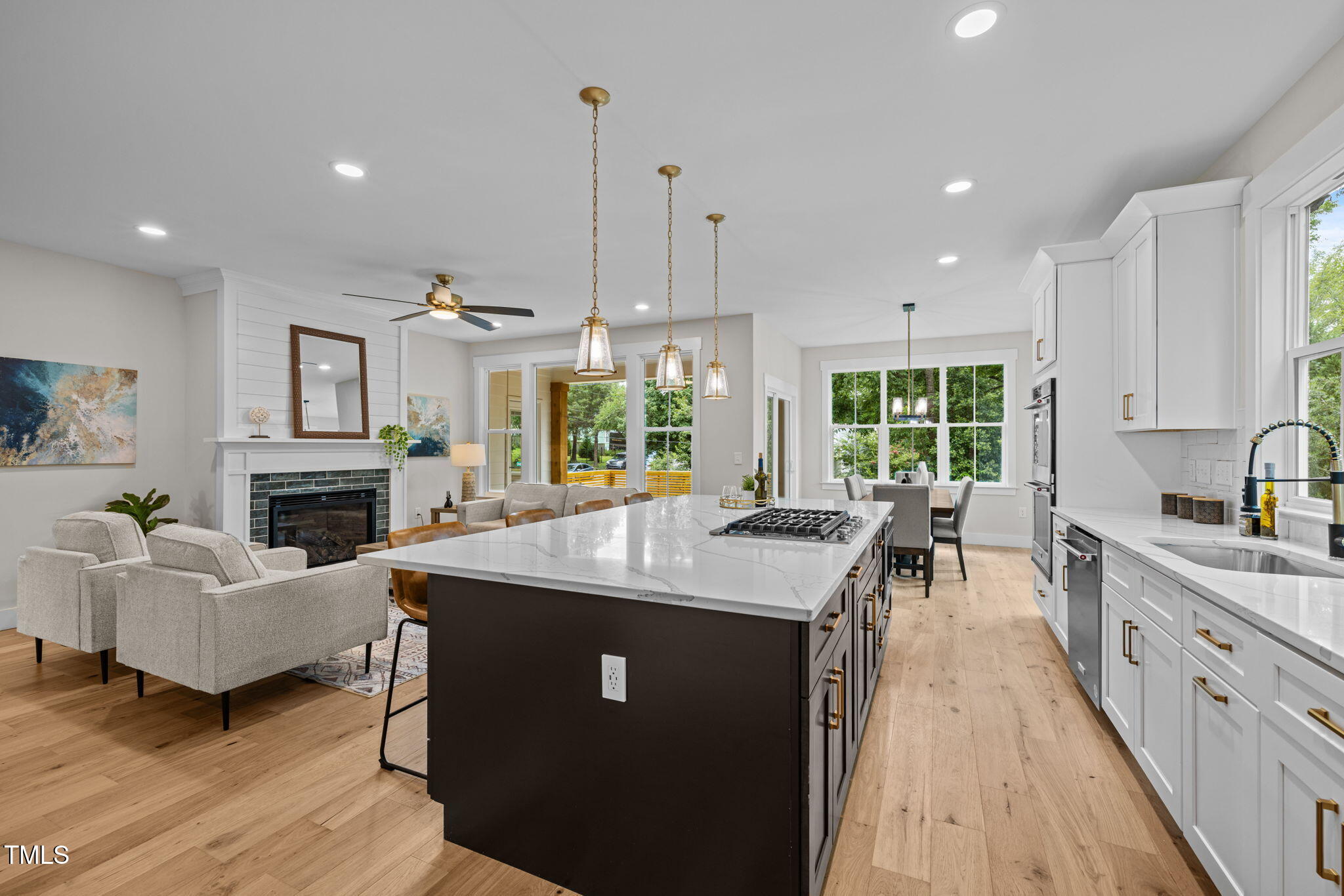 121 West Braxton Foushee Street Carrboro, NC 27510 - Photo 8 of 50 a kitchen with sink stove and living room