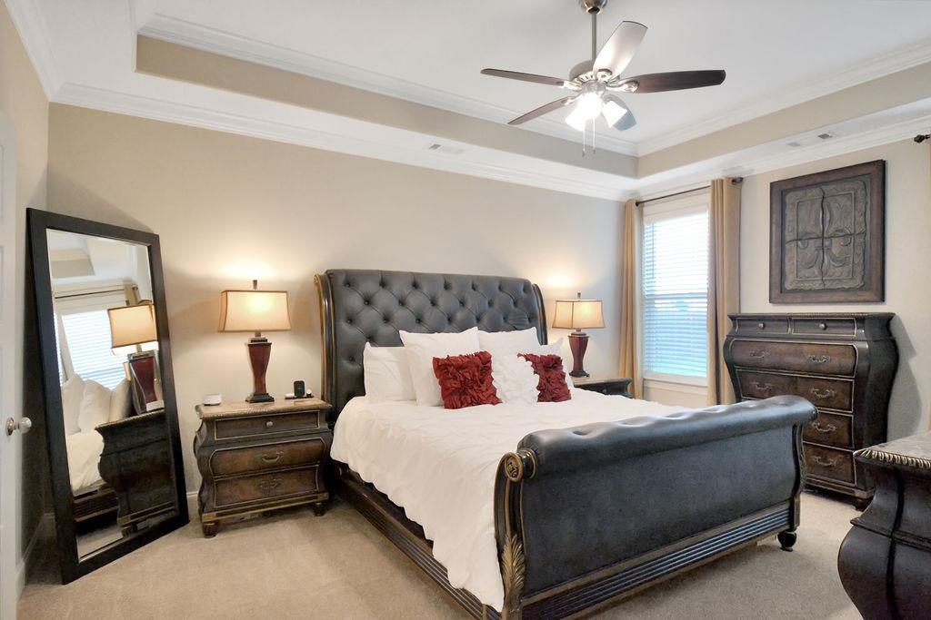 70 Trinity Cove Atoka, TN 38004 - Photo 6 of 20 a bedroom with a bed and a chandelier