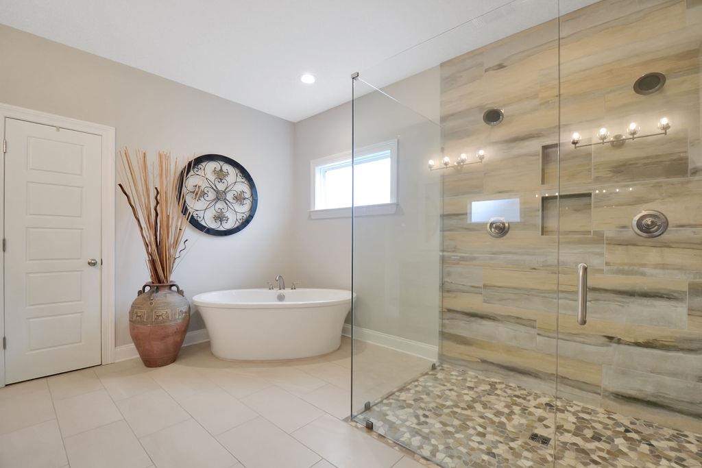 70 Trinity Cove Atoka, TN 38004 - Photo 8 of 20 a bathroom with a bathtub and a shower