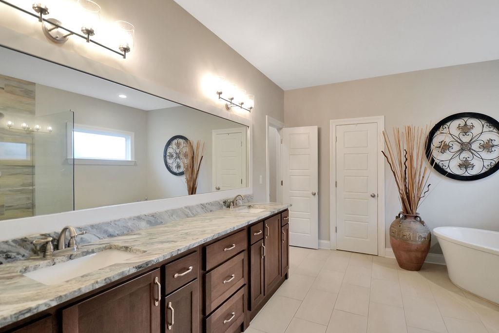70 Trinity Cove Atoka, TN 38004 - Photo 9 of 20 a spacious bathroom with a double vanity sink and a mirror