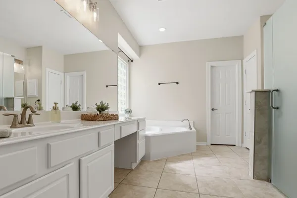 a bathroom with a sink and mirror