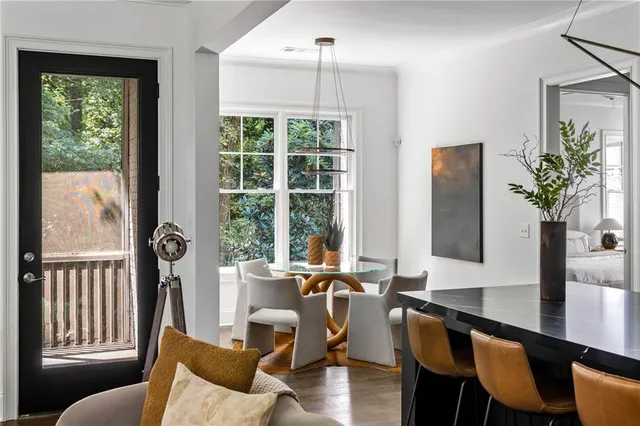 a view of a dining room with furniture window and outside view