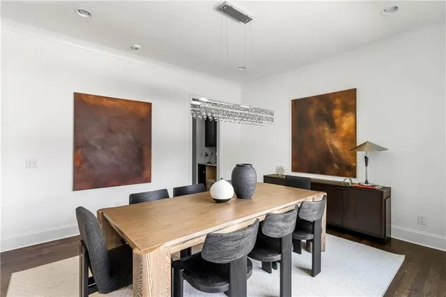 a view of a dining table and chairs in a room