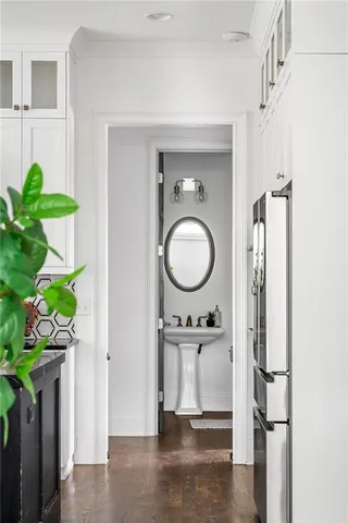 a close view of a utility room with wooden floor