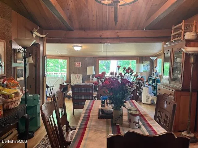 a view of a dining room with furniture and chandelier