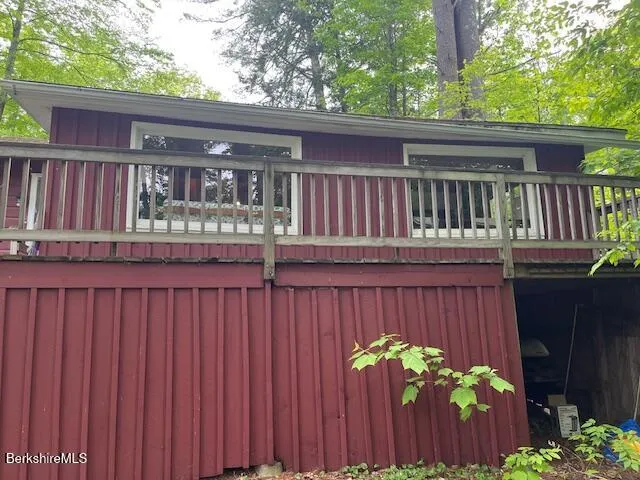a view of a wooden door and a yard