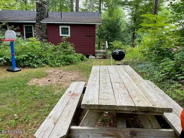 a view of backyard with seating space