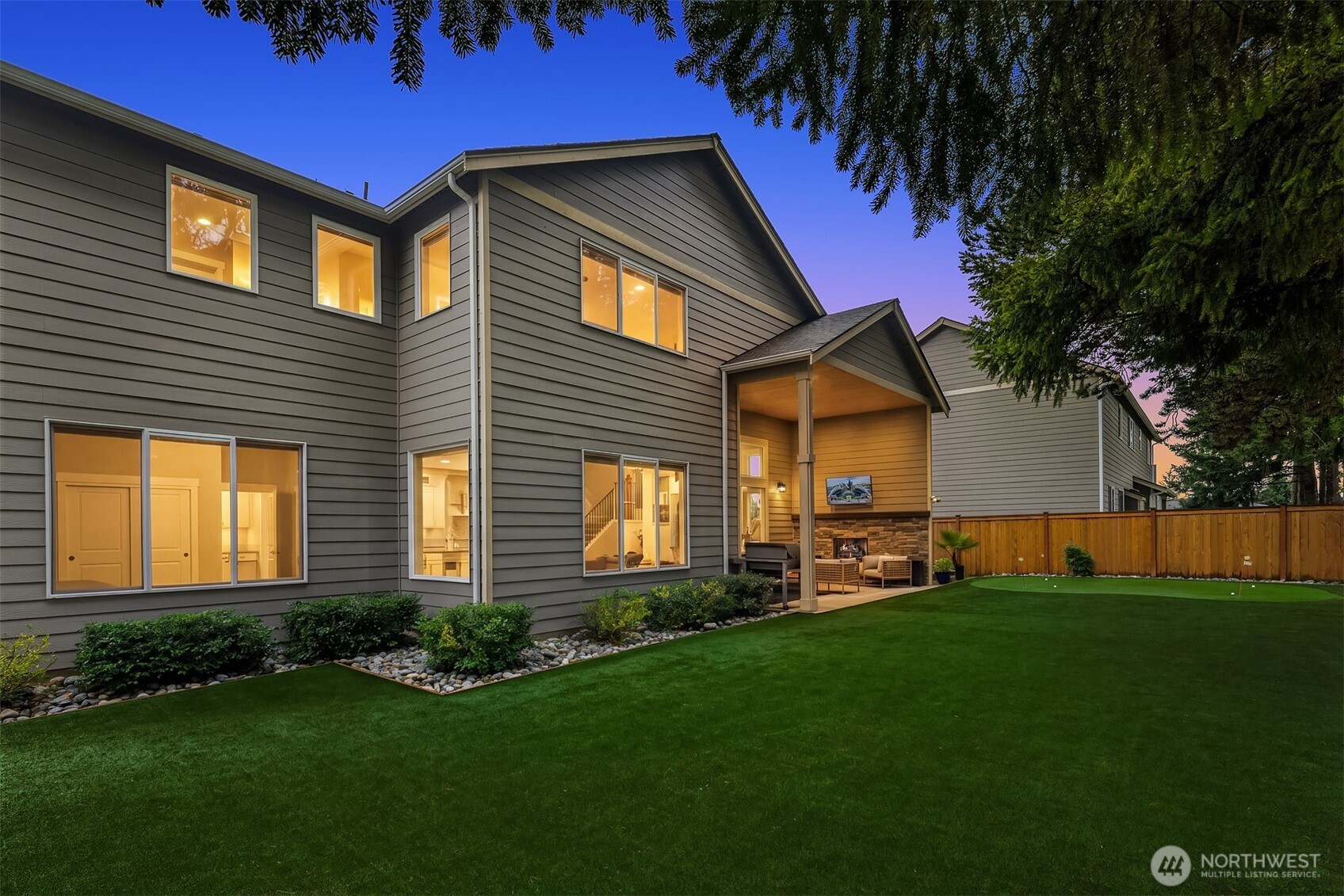 1435 242nd Place Southeast Bothell, WA 98021 - Photo 4 of 40 a front view of a house with a garden and yard