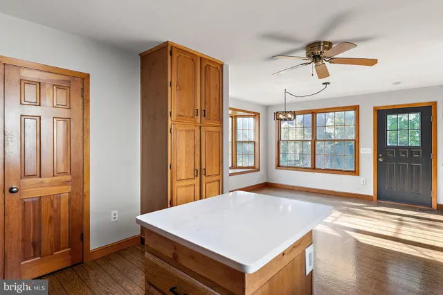 a view of an entryway with wooden floor