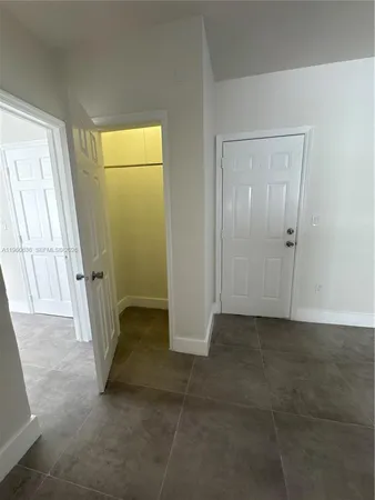 an empty room with closet area