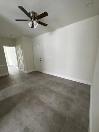 an aerial view of a house with a yard basket ball court and outdoor seating