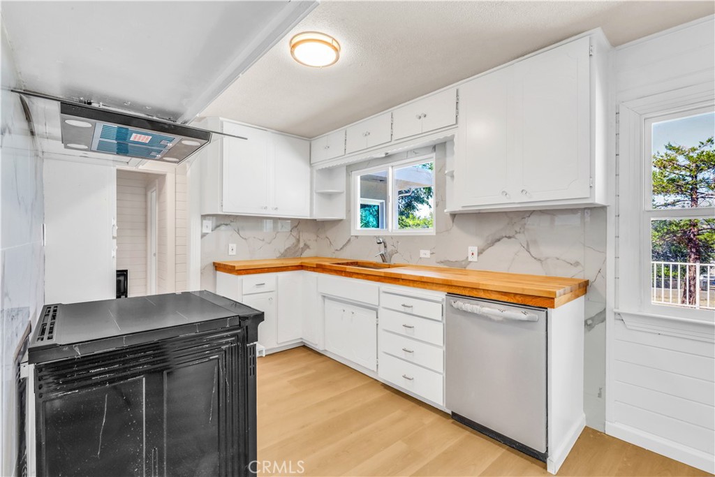 15905 Kugelman Street Lower Lake, CA 95457 - Photo 55 of 75 a kitchen with stainless steel appliances granite countertop a stove and a sink