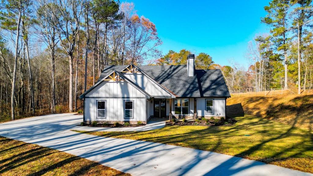 2043 Avery Road Canton, GA 30115 - Photo 1 of 1 a view of a house with pool and sitting area