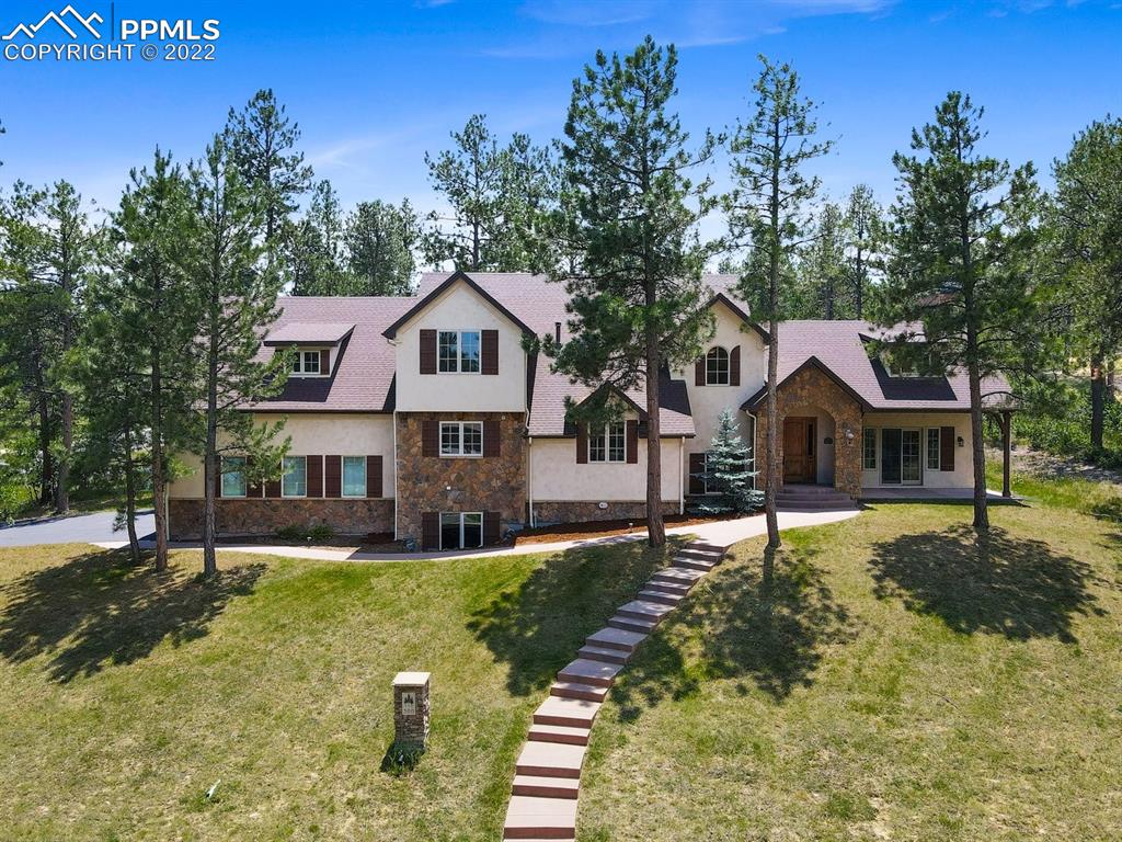 a front view of a house with a yard