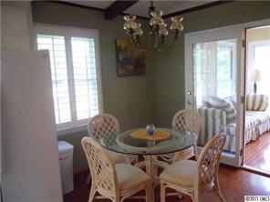 3932 Lake Shore Road South Denver, NC 28037 - Photo 10 of 16 a view of a dining room with furniture window and wooden floor