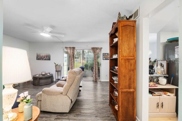 631 Silver Pass, Unit A Ocala, FL 34472 - Photo 11 of 47 a living room with furniture and a fireplace